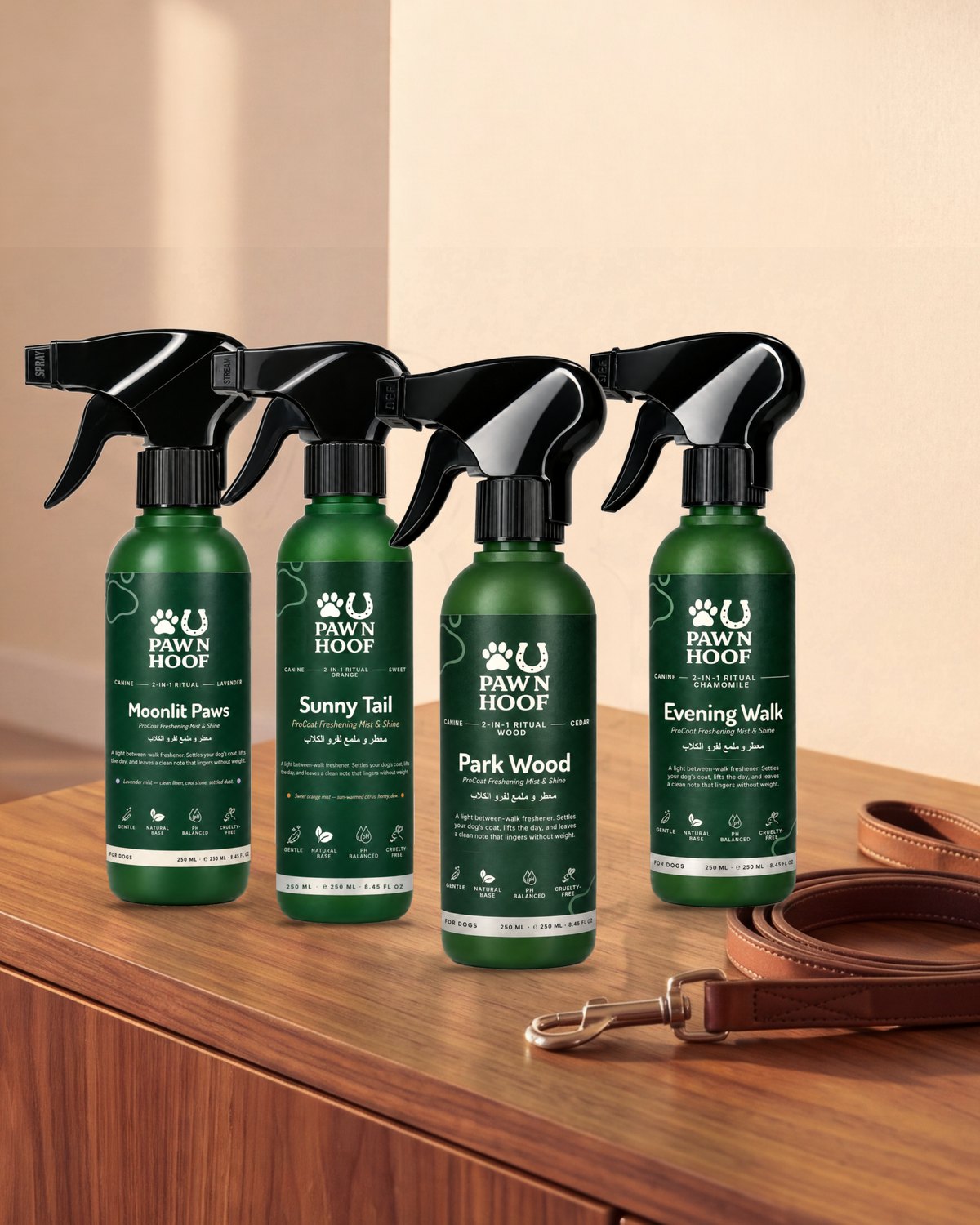 Four Paw N Hoof dog coat freshening mist spray bottles on a wooden sideboard with a leather lead
