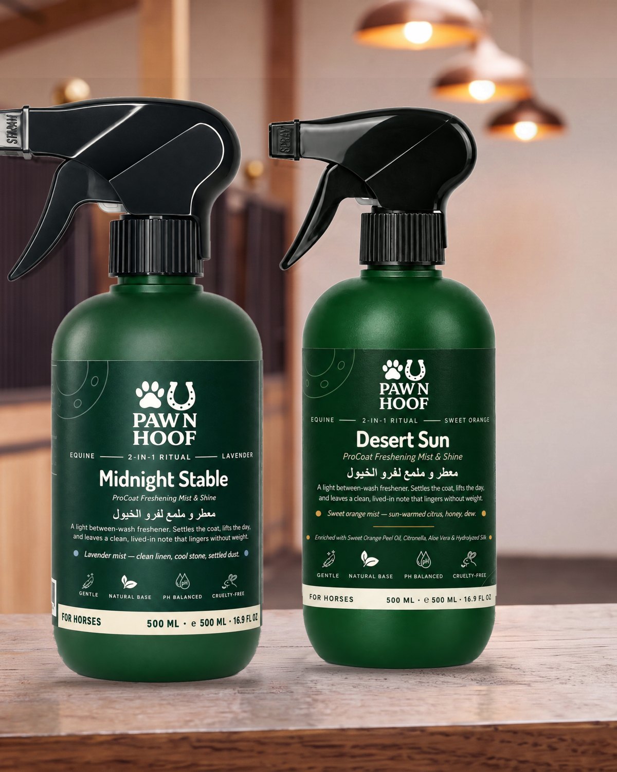 Midnight Stable and Desert Sun horse coat mist spray bottles on a wooden table in a stable aisle